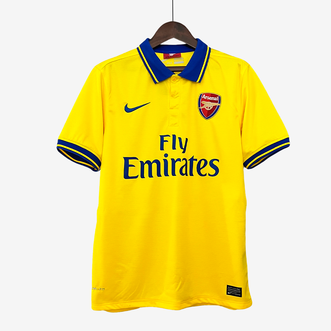 9-17_fe7a6f40-6c69-4cf8-8da4-7274d599face Arsenal 2013/14 Away Jersey – Retro Version - Image 1