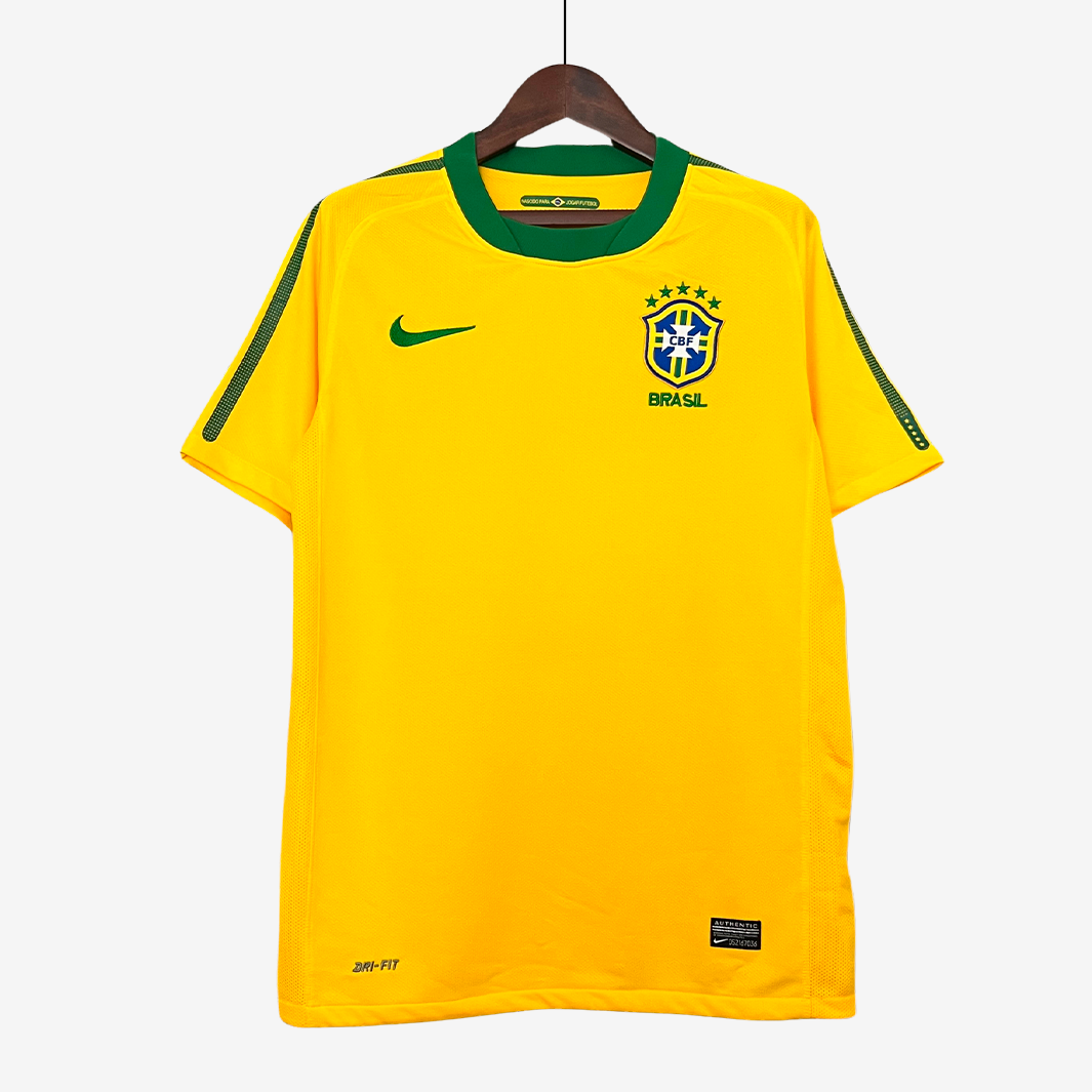 9-21_9d9214b4-63a3-46ec-8eee-a004e1e2694b Brazil 2010 Home Jersey – Retro Version - Image 1